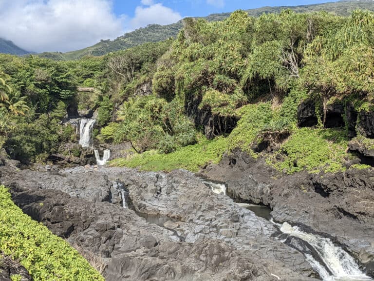 Water cascading down several waterfalls into seven different pools