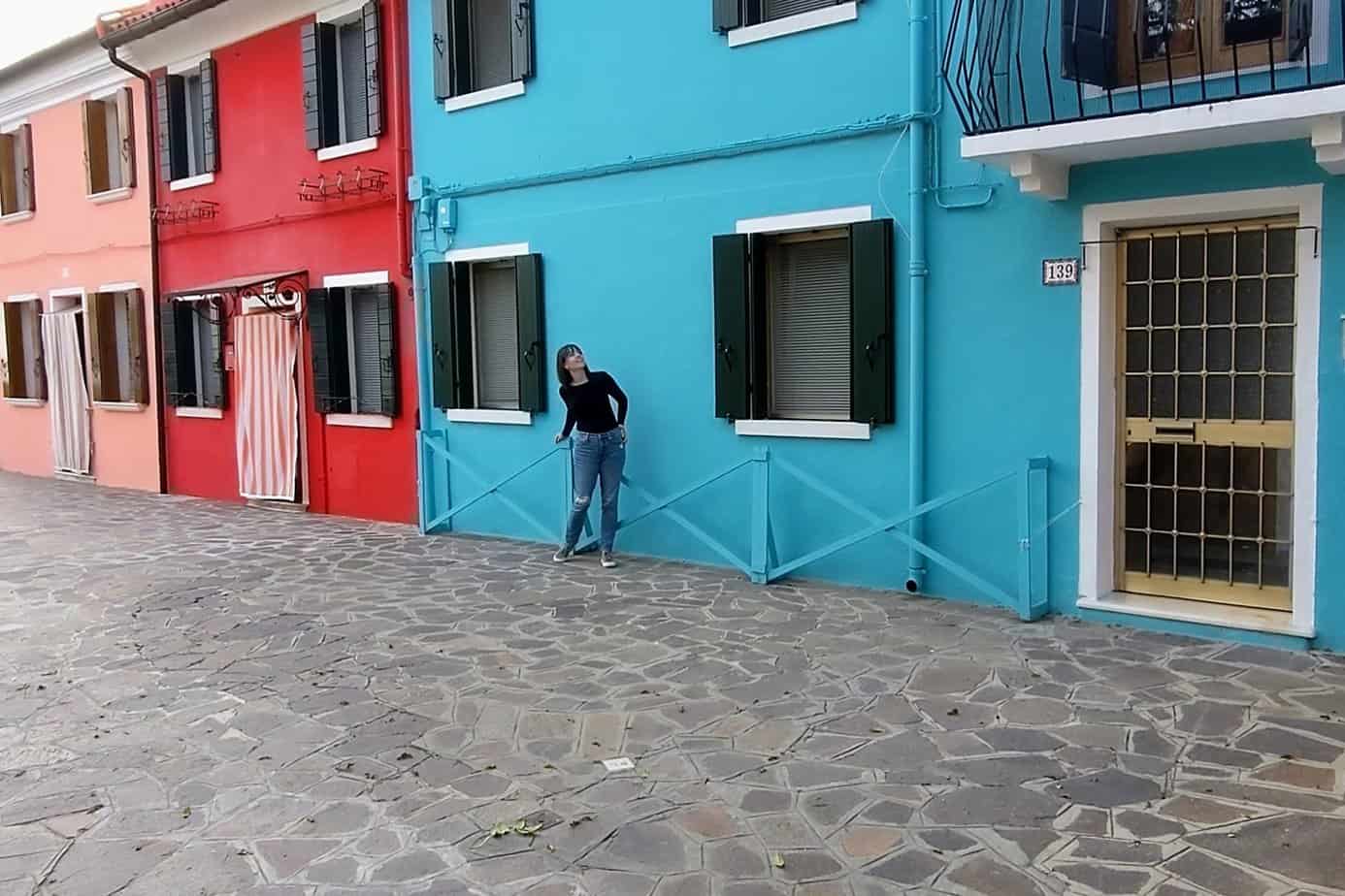 In front of a teal house