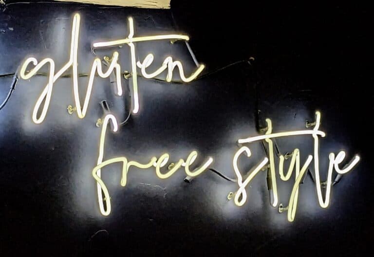 Gluten-Free Style written in neon lights on a black background.